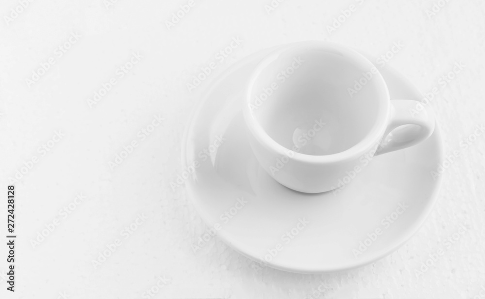 closeup top view on white coffee cup and saucer, empty coffee-free coffee cup, for black coffee, on a white background closeup top view on white coffee cup and saucer, empty coffee-free coffee cup, for black coffee, on a white background