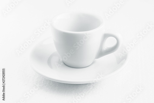 white coffee cup and saucer, empty coffee-free coffee cup, front view from above, or black coffee, on a white background