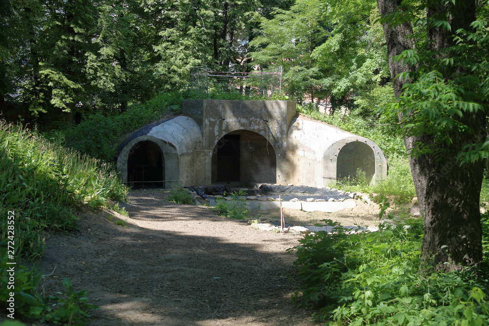 Unfinished bomb shelter made of durable concrete in a city block