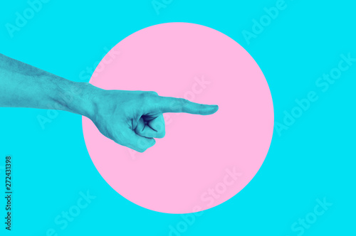 Isolated on blue background painted man hand photo on pink circle. Surrealist...