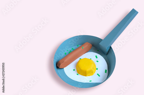 Paper pan with paper fried eggs and sausage