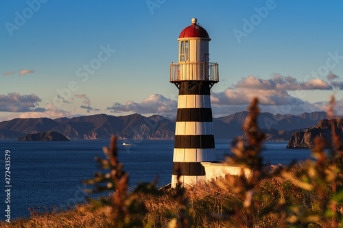 Petropavlovsky Lighthouse (founded in 1850) - oldest lighthouse in Russian Far East, located on Kamchatka Peninsula on shore of Avacha Gulf in Pacific Ocean, vicinity of Petropavlovsk-Kamchatsky City. photo