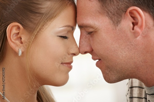Loving couple with closed eyes