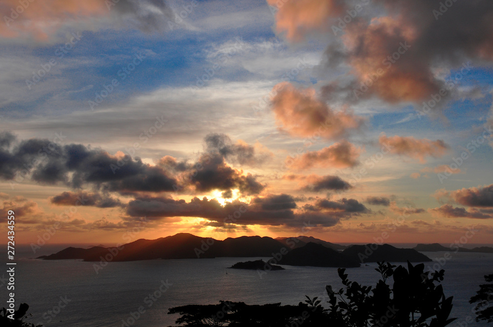 Sunset of the Island of Praslin from La Digue Island, Seychelles