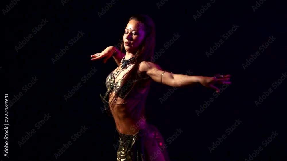 tempting woman is dancing energetically oriental dances in darkness tempting woman is dancing energetically oriental dances in darkness