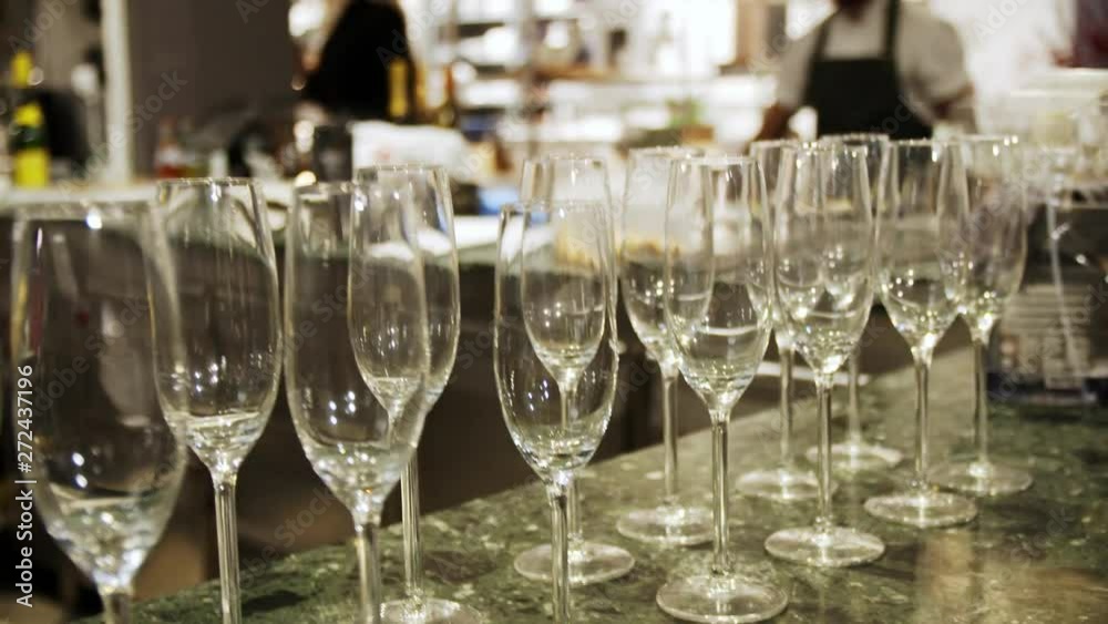 Close-up shot of some champagne glasses on a restaurant counter. Close-up shot of some champagne glasses on a restaurant counter.