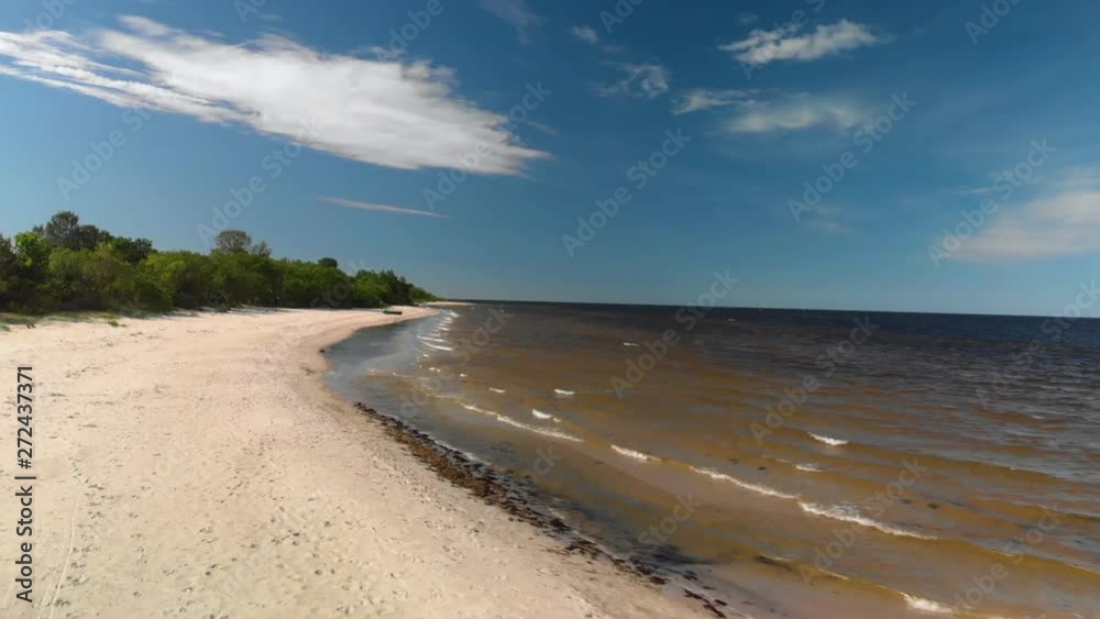 Aerial flying over beautiful white paradise sand beach in Latvia and the Baltic Sea Gulf Aerial flying over beautiful white paradise sand beach in Latvia and the Baltic Sea Gulf