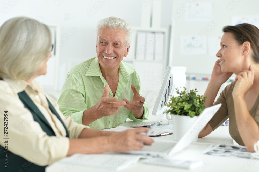 Working business people in modern light office