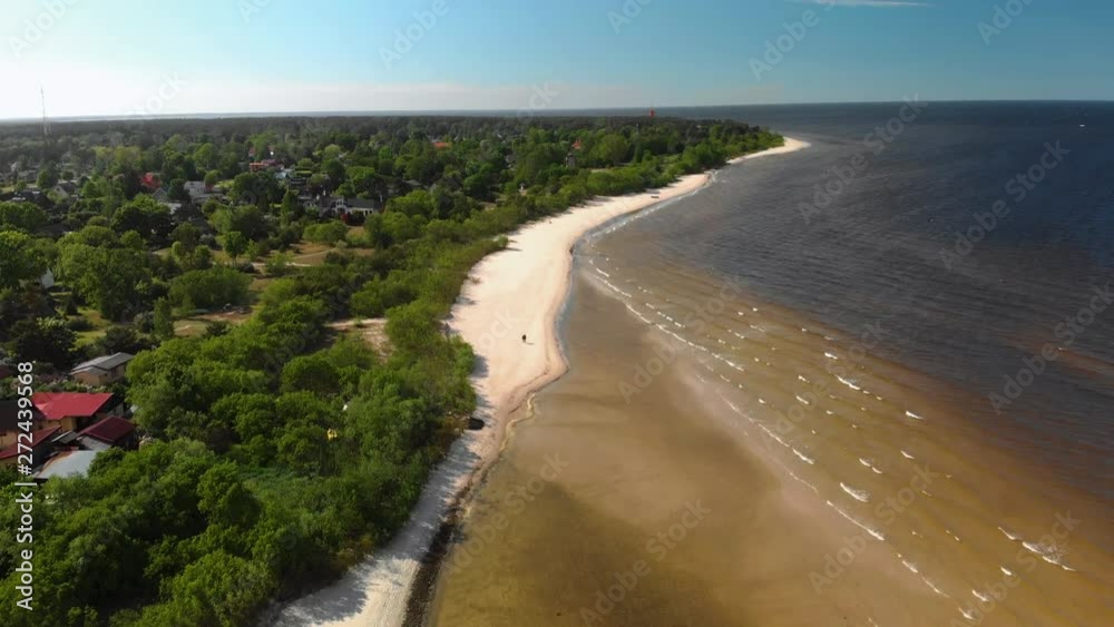Aerial flying over beautiful white paradise sand beach in Latvia and the Baltic Sea Gulf Aerial flying over beautiful white paradise sand beach in Latvia and the Baltic Sea Gulf
