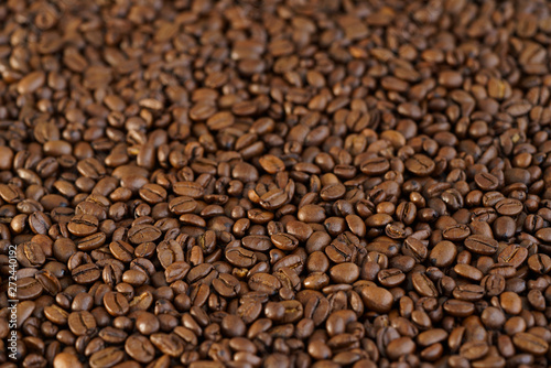 Roasted coffee beans on a table. Selective focus, high resolution