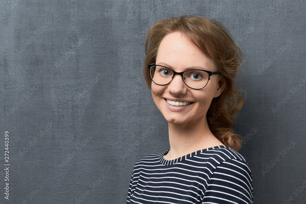Portrait of happy girl with eyeglasses smiling broadly Portrait of happy girl with eyeglasses smiling broadly