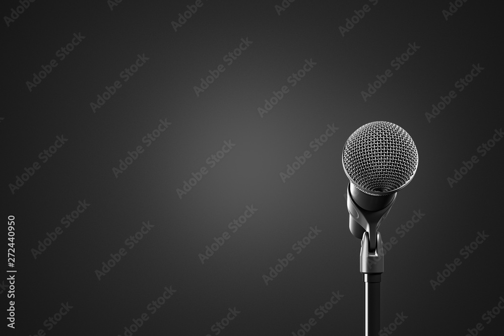 Front view of the black microphone with stand on the black background. Front view of the black microphone with stand on the black background.