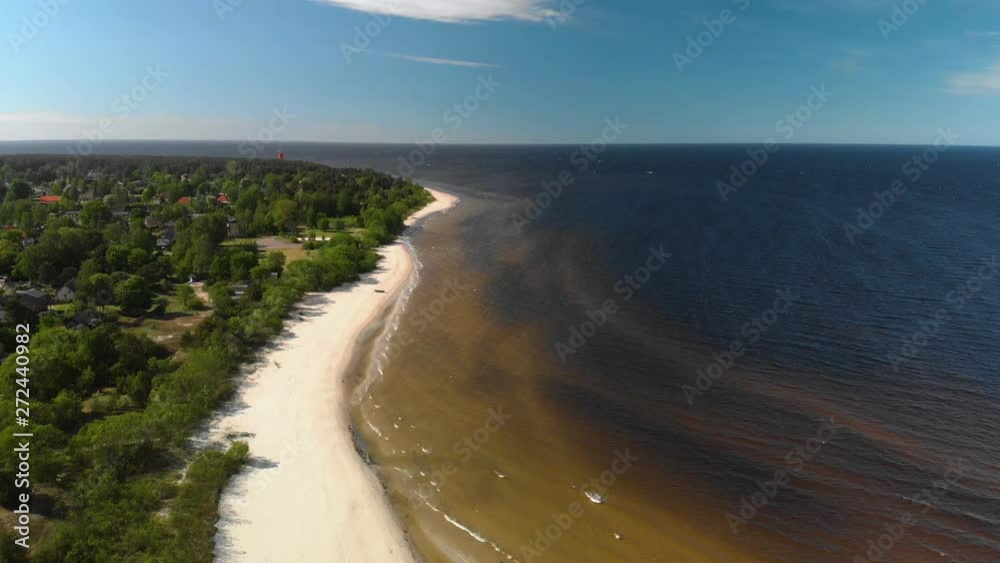Aerial flying over beautiful white paradise sand beach in Latvia and the Baltic Sea Gulf Aerial flying over beautiful white paradise sand beach in Latvia and the Baltic Sea Gulf
