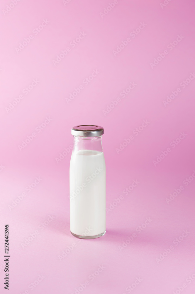 bottle of milk on pink background bottle of milk on pink background