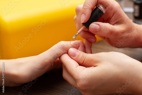 manicure process nail polish on white background. 
