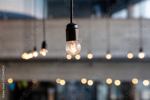 Light bulb in concrete building photo
