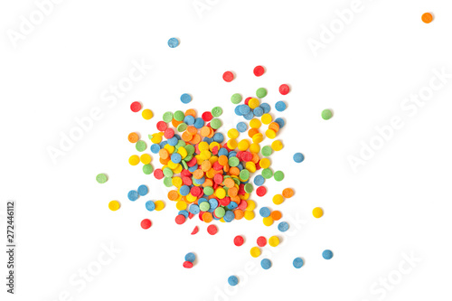 Сolorful round sprinkles or sugar confetti on white background. Sugar sprinkle dots, decoration for cake and bakery. 