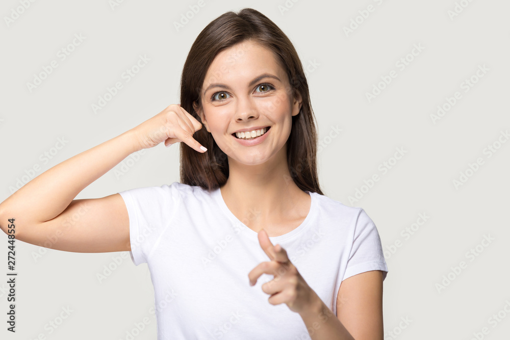 Woman imitate cellphone with hand make call me gesture Woman imitate cellphone with hand make call me gesture