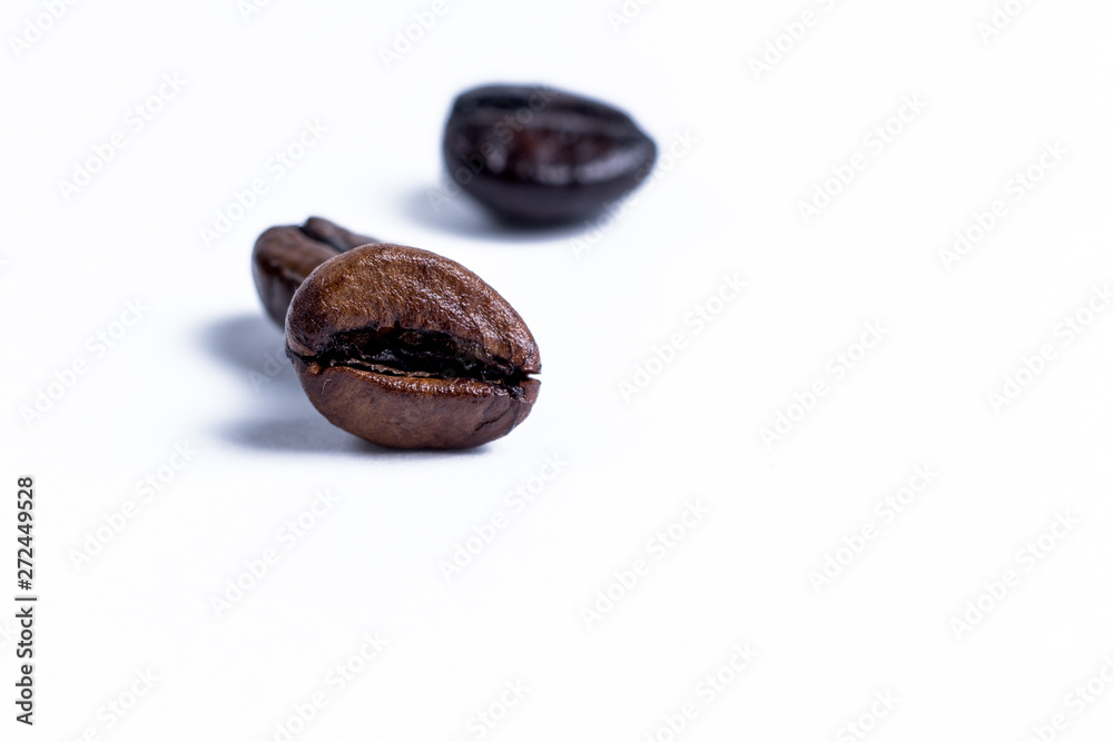 Roasted coffee beanon white
