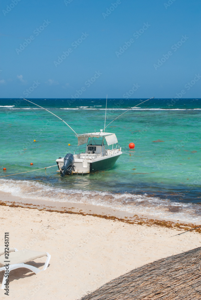 Fishing boat shot in Tulum, in the Mexican Yucatan peninsula Fishing boat shot in Tulum, in the Mexican Yucatan peninsula
