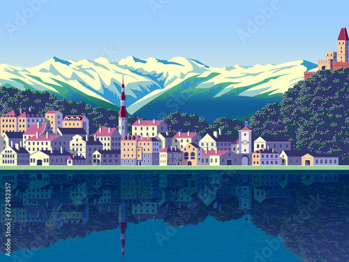 Summer landscape with the small town, lake and mountains in the background