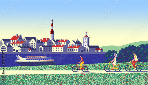 Cyclists on a country walk with the city, river and pleasure boat in the background.