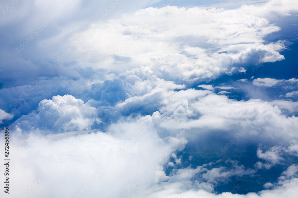 White clouds on blue sky background close up, cumulus clouds high in azure skies, beautiful aerial cloudscape view from above, sunny heaven landscape, bright cloudy sky view from airplane, copy space White clouds on blue sky background close up, cumulus clouds high in azure skies, beautiful aerial cloudscape view from above, sunny heaven landscape, bright cloudy sky view from airplane, copy space