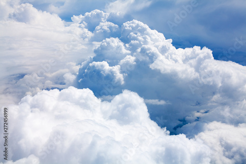 Fototapeta Naklejka Na Ścianę i Meble -  White clouds on blue sky background close up, cumulus clouds high in azure skies, beautiful aerial cloudscape view from above, sunny heaven landscape, bright cloudy sky view from airplane, copy space