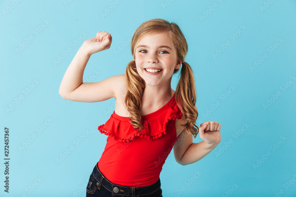 Cheerful little girl wearing swimsuit standing isolated Cheerful little girl wearing swimsuit standing isolated