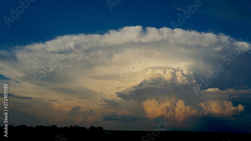 Storm clouds over vast prairies Ranches and farms bold sky powerful force of nature