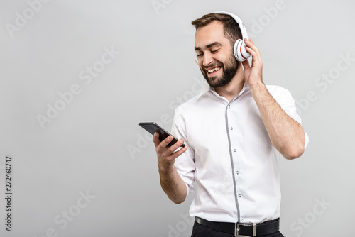 Handsome confident businessman wearing suit standing