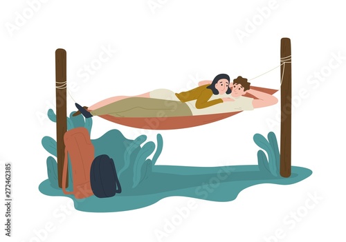 Funny young man and woman lying together in hummock
