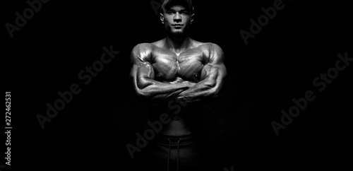 Bodybuilding competitions on the scene. Man sportsmen bodybuilder physique and athlete. Fitness motivation. Black and white photo.