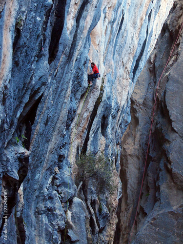 A strong rock climbing man in Turkey, Geyikbayiri çitdibi (lead climbing outdoors) 