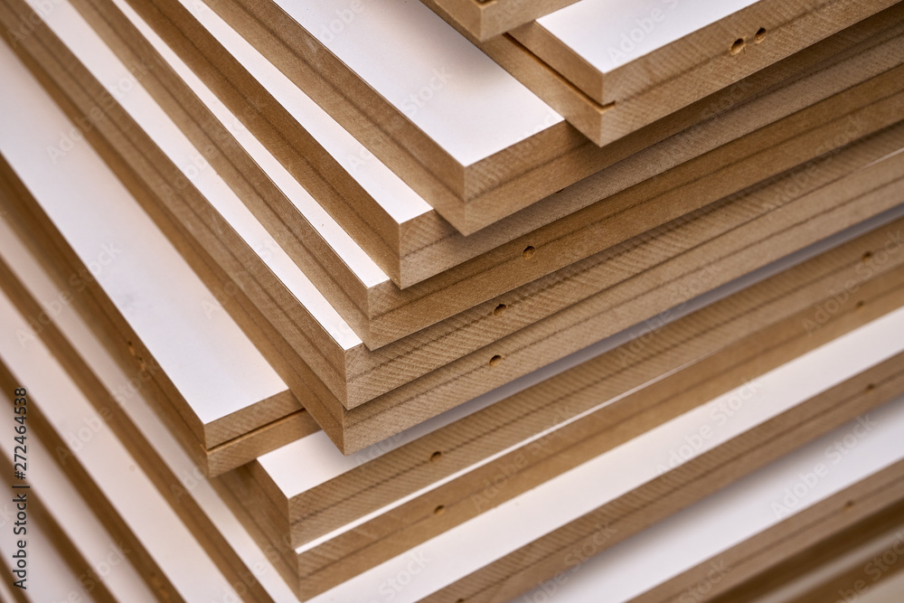 Obraz premium Laminated MDF bookshelves. Production of wood furniture. Furniture manufacture. Close-up
