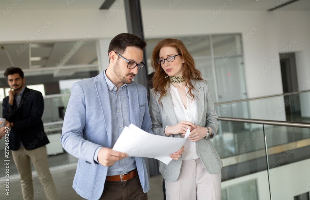 Business people working together in office hall. Business people working together in office hall.
