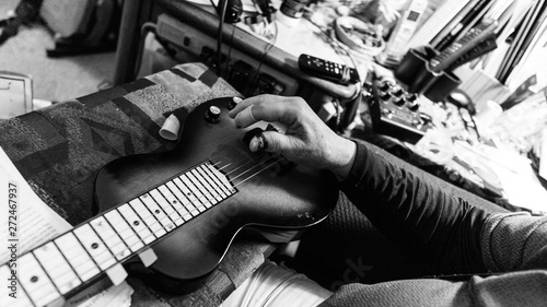 Arthritic hands playing the guitar weathered old hands playing music photo