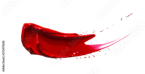 Red lipstick or acrylic paint isolated on white