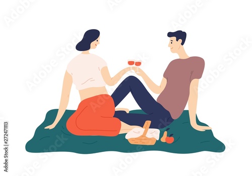 Cute couple drinking wine during romantic date outdoors