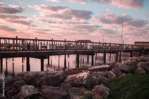 wooden boat dock marina at sunrise