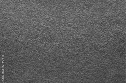Asphalt gray felt texture abstract art background. Solid color material with grain surface. Empty space.