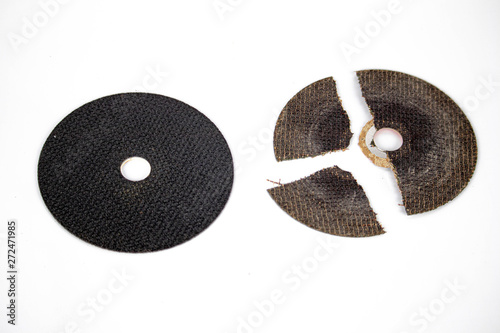 good and dangerous broken cracked cutting wheels abrasive comparison safety work disc isolated white background photo close up