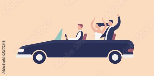 Funny newlyweds riding in cabriolet car with driver and rejoicing