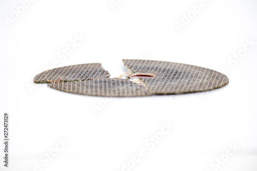 broken cracked cutting wheels abrasive disc isolated white background photo close up side view