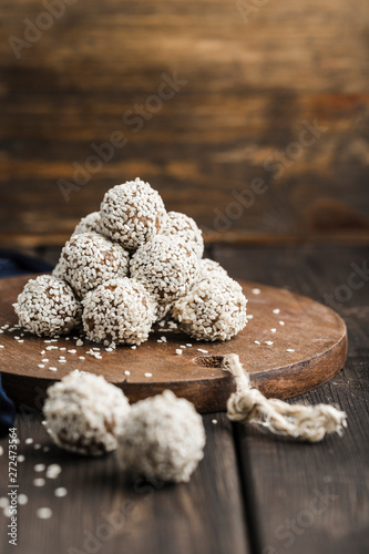 nergy balls of nuts oats and dates with sesame seeds photo