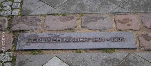Photography Engraving on the Street Marking Location of Where the Berlin Wall Used to Run