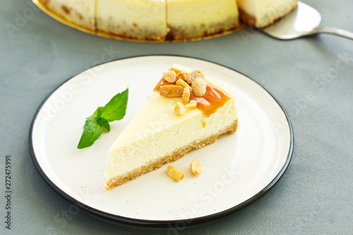 Cheesecake with caramel and peanuts. Slice.