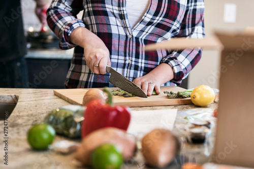 Meal: Woman Cutting Up Asparagus For Dinner photo