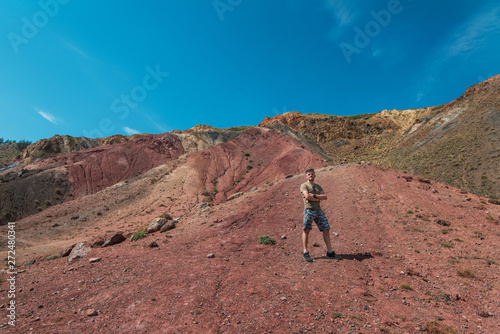 Man in Valley of Mars landscapes in the Altai Mountains,