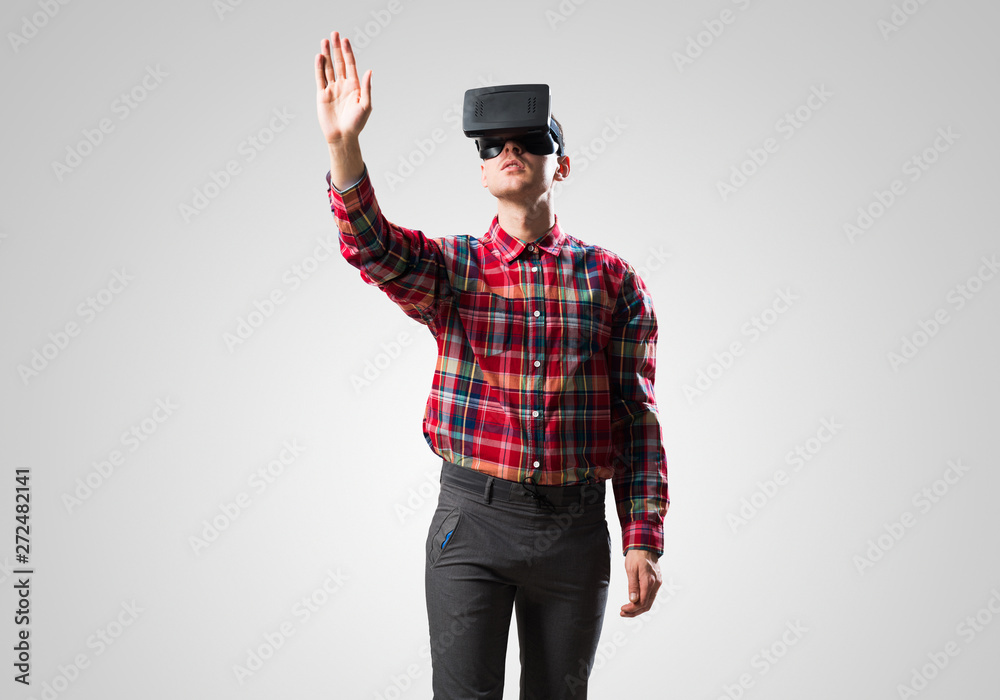 Guy in mask experiencing virtual reality as new entertainment device Guy in mask experiencing virtual reality as new entertainment device